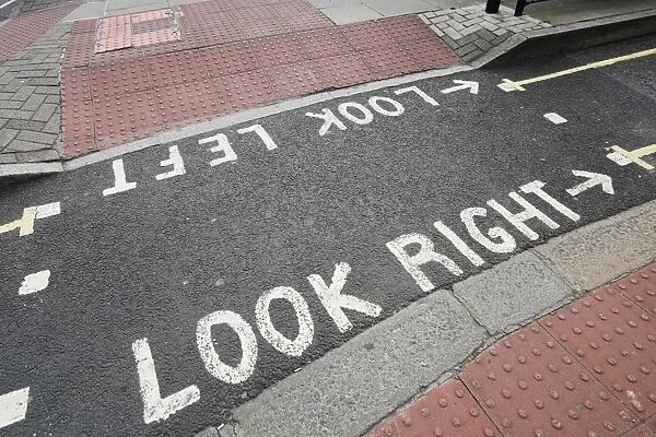 Pavement with a labelled road crossing, London, England, United Kingdom