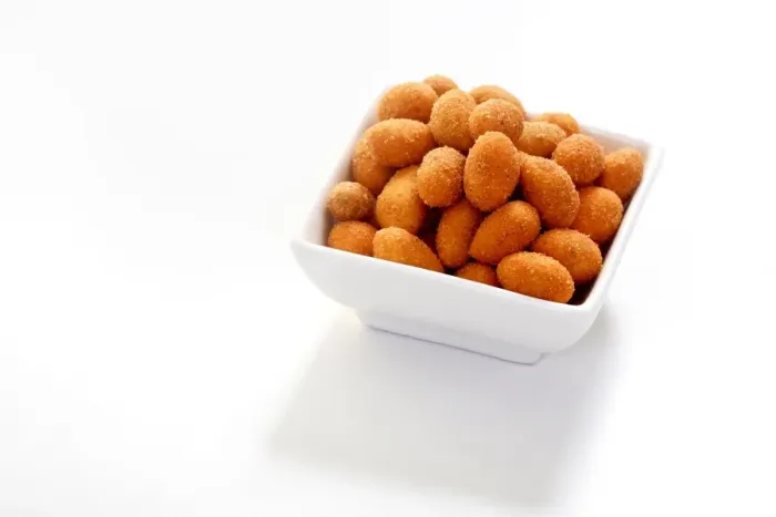 Framed Print : Peanuts in a paprika flavoured coating, in a bowl Framed Print : Peanuts in a paprika flavoured coating, in a bowl