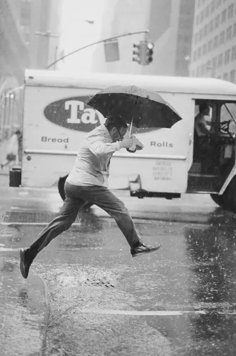 Framed Print : Pedestrian Leaping Over Puddle Framed Print : Pedestrian Leaping Over Puddle