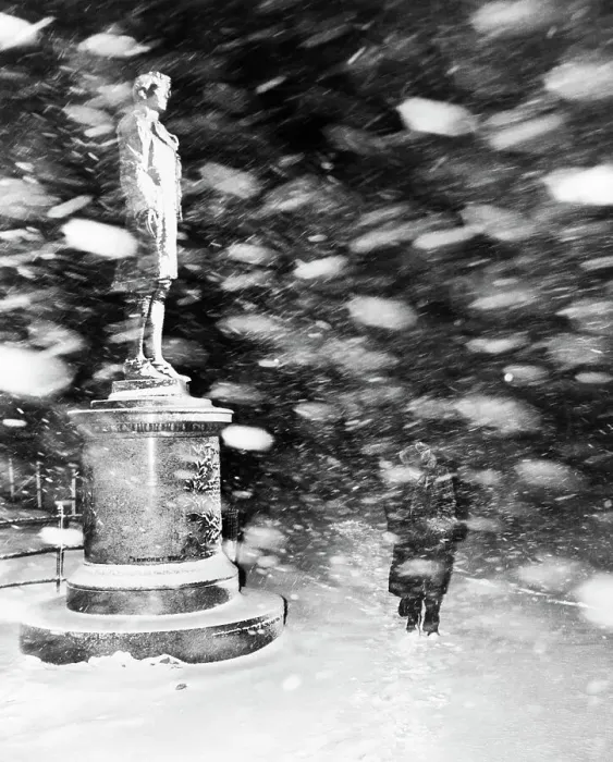 Framed Print : Pedestrian Passing Statue in Snow Storm