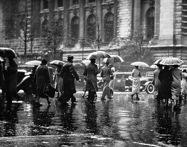 Pedestrian passing street, rainy weather, New York, USA (B&W)
