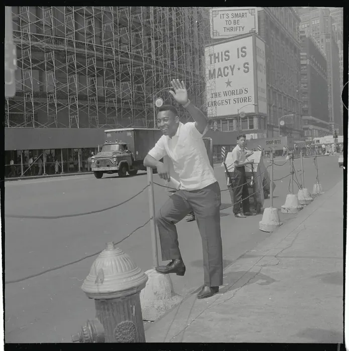 Framed Print : Pele Standing by Macy's Sign on Street Framed Print : Pele Standing by Macy's Sign on Street