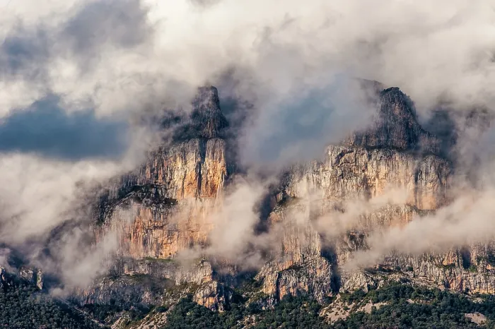 Framed Print : The Peña mountains to the north of Ainsa, Spain partially covered in clouds during dusk Framed Print : The Peña mountains to the north of Ainsa, Spain partially covered in clouds during dusk