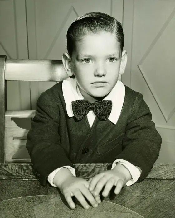 Framed Print : Pensive boy (4-5) posing at table, (B&W), portrait Framed Print : Pensive boy (4-5) posing at table, (B&W), portrait