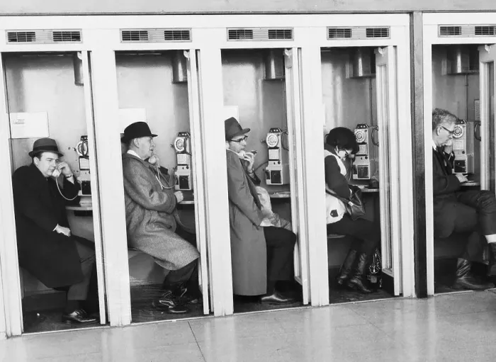 Framed Print : People at Airport In Pay Phone Booths Framed Print : People at Airport In Pay Phone Booths