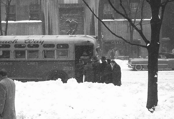 People boarding on bus in winter, (B&W)