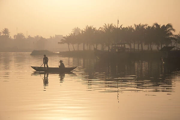 People on the boat in early morning in Hoian, Vietnam