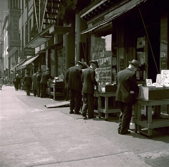 Framed Print : People Browsing Through Used Books Framed Print : People Browsing Through Used Books