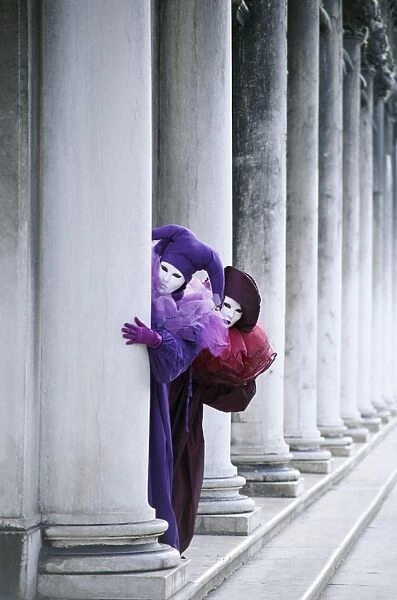 Two People in Carnival Costume Hiding Behind a Column, Venice, Italy, Europe