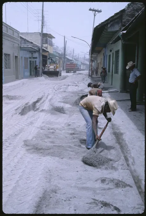Framed Print : People Cleaning Debris from Eruption Framed Print : People Cleaning Debris from Eruption