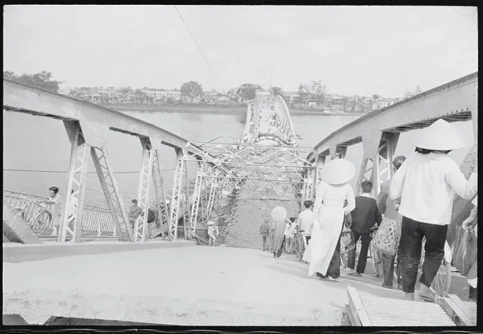 Framed Print : People Crossing a Bridge Framed Print : People Crossing a Bridge