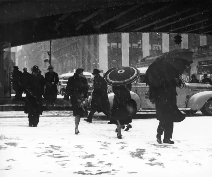 Framed Print : People crossing city street in snow stor