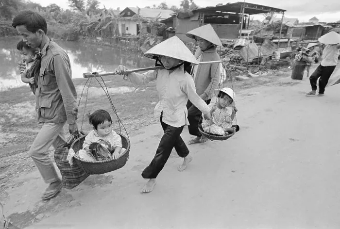 Framed Print : People Flee, Carry Children In Baskets Framed Print : People Flee, Carry Children In Baskets