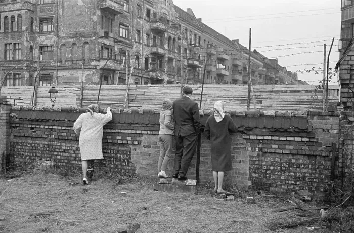 Framed Print : People Look Over Barb Wire at Berlin Wall Framed Print : People Look Over Barb Wire at Berlin Wall
