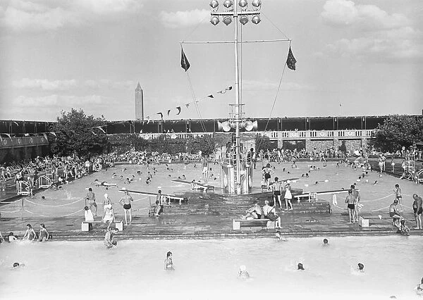 People at outdoor swimming pool, elevated view