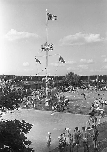 People at outdoor swimming pool, elevated view