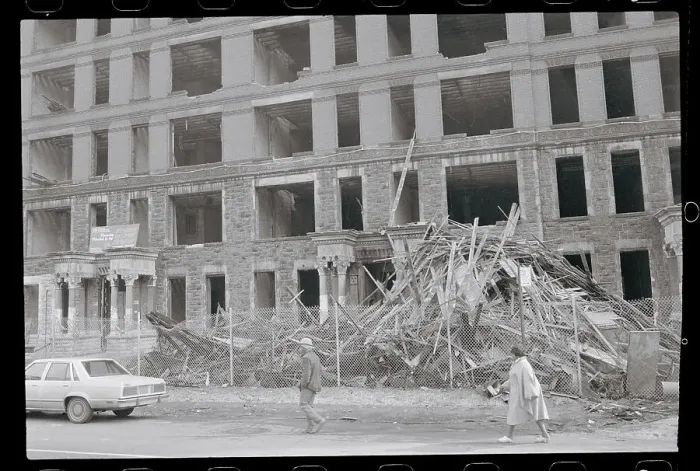Framed Print : People Passing by a Vacant Building Framed Print : People Passing by a Vacant Building