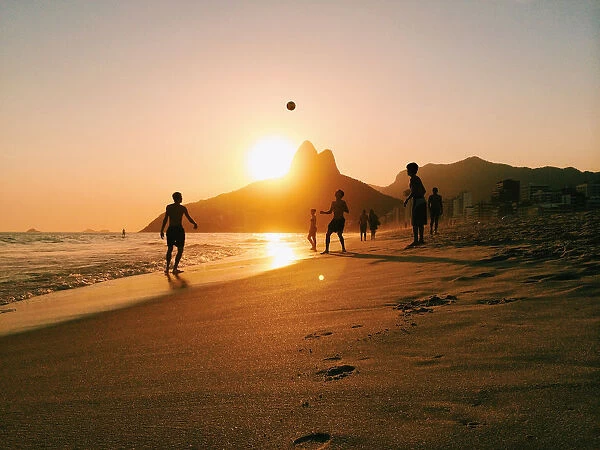 People playing football on Ipanema beach in Rio