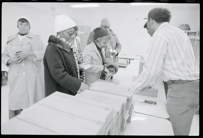 Framed Print : People Receiving Boxes of Cheese Framed Print : People Receiving Boxes of Cheese