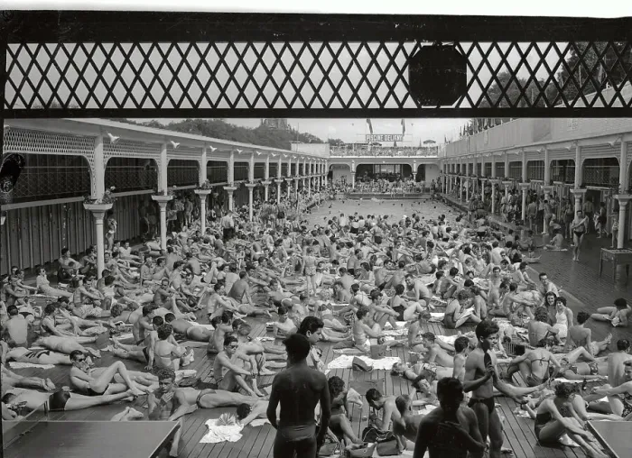 Framed Print : People Relaxing By a Swimming Pool