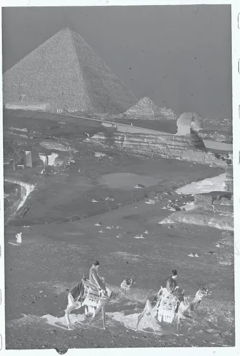 Framed Print : People Riding Camels with Pyramids and Sphinx in Background