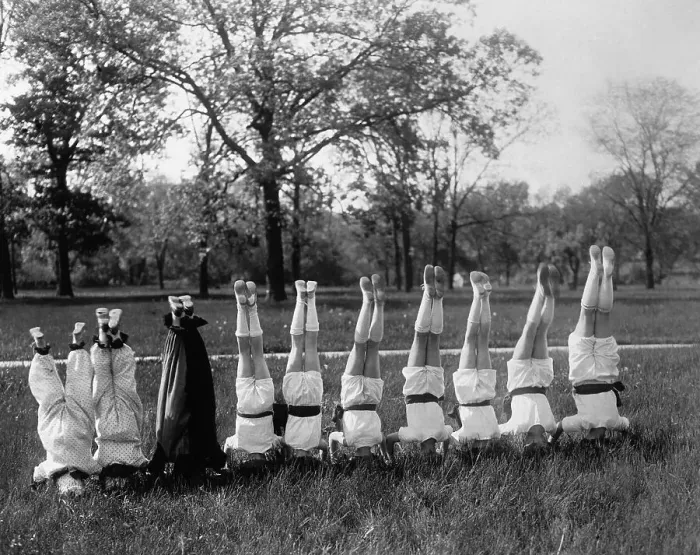 Framed Print : People in row standing on head outdoors