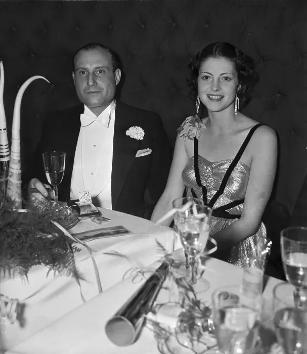 Framed Print : Two People Seated at Table at New Years Party Framed Print : Two People Seated at Table at New Years Party