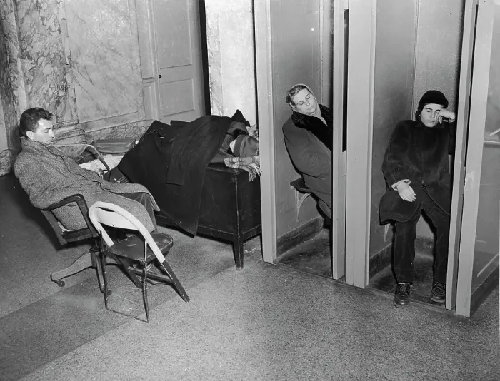 Framed Print : People Sleeping in Lobby Phone Booths