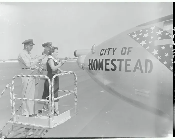 Framed Print : People Standing by the Nose of a Plane Framed Print : People Standing by the Nose of a Plane