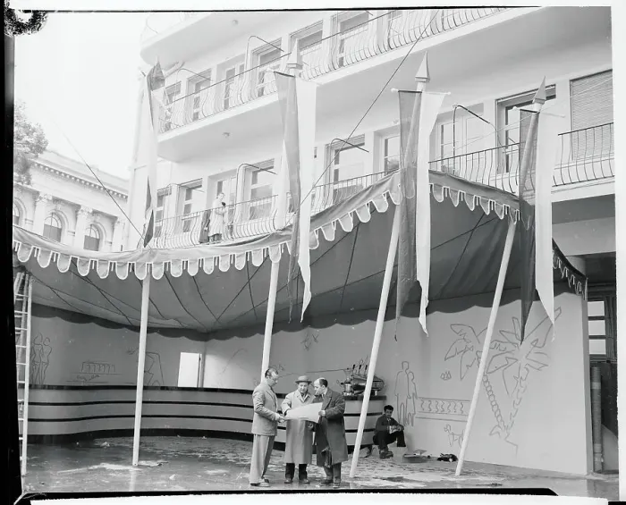 Framed Print : People Standing Underneath an Awning Framed Print : People Standing Underneath an Awning