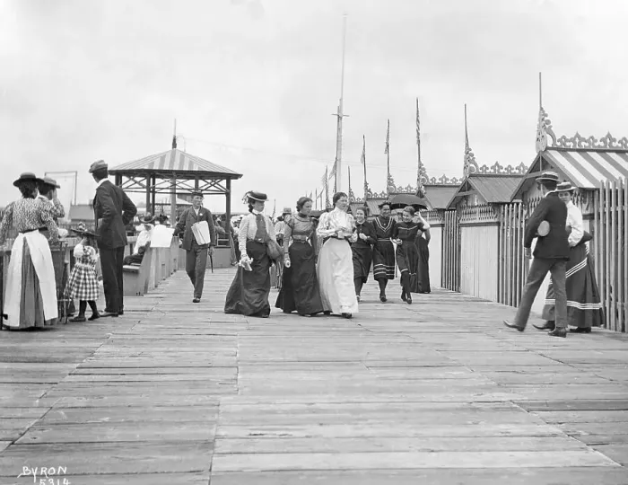 Framed Print : People Strolling on Boardwalk Framed Print : People Strolling on Boardwalk