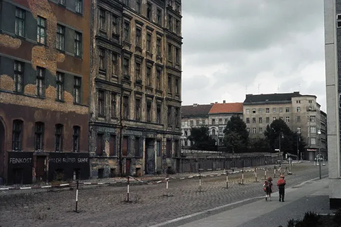 Framed Print : People Strolling Past the Berlin Wall