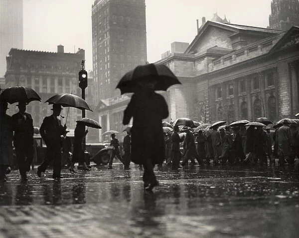 People with umbrellas in urban scene