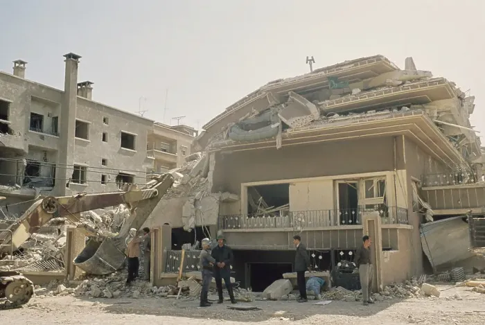 Framed Print : People Viewing Damage in Damascus