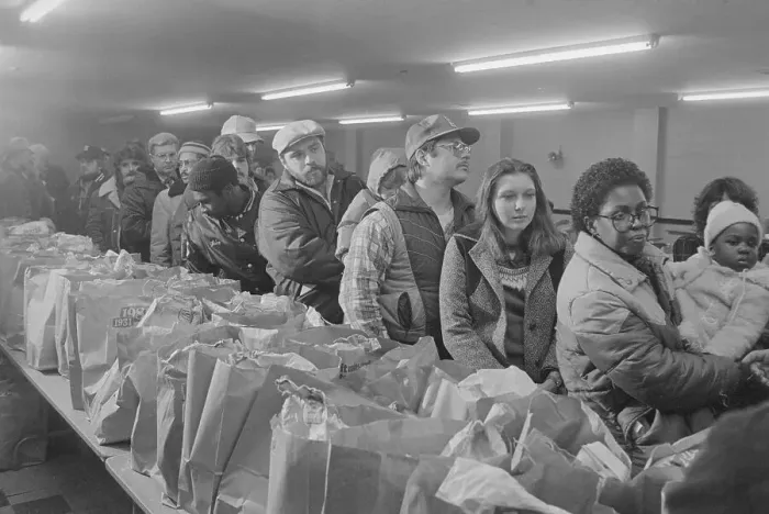 Framed Print : People Waiting in Line at a Food Bank