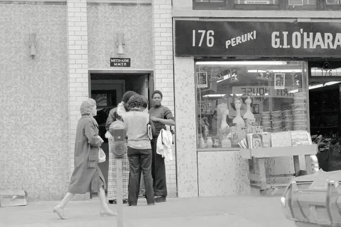 Framed Print : People Waiting Outside of a Clinic Framed Print : People Waiting Outside of a Clinic