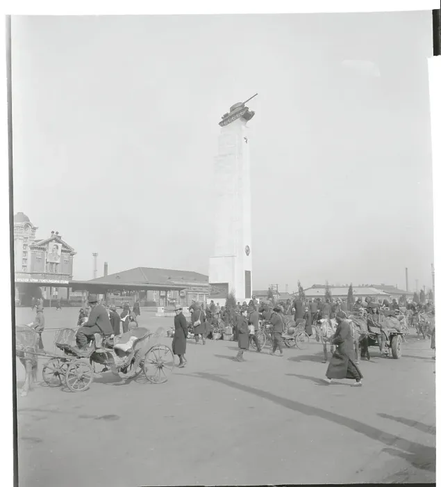 Framed Print : People Walking Past Monument Framed Print : People Walking Past Monument