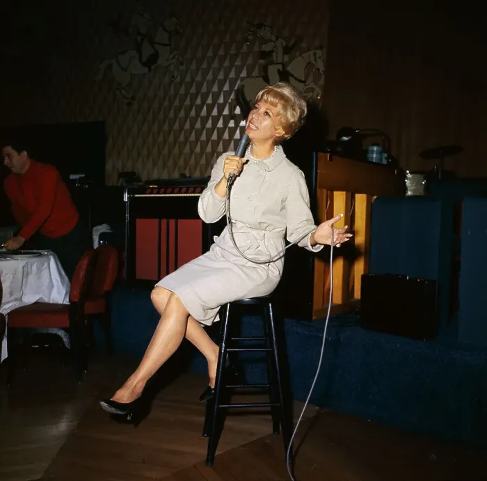 Framed Print : Performer Dinah Shore Singing on Stool With Microphone Framed Print : Performer Dinah Shore Singing on Stool With Microphone