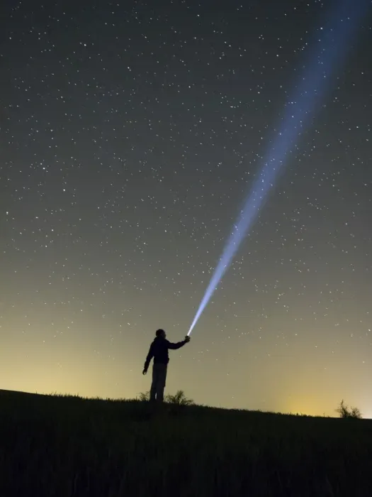 Framed Print : Person lighting the sky with a flashlight Framed Print : Person lighting the sky with a flashlight