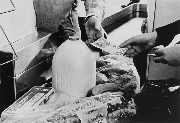 Framed Print : Person Making a Purchase with Food Stamps Framed Print : Person Making a Purchase with Food Stamps