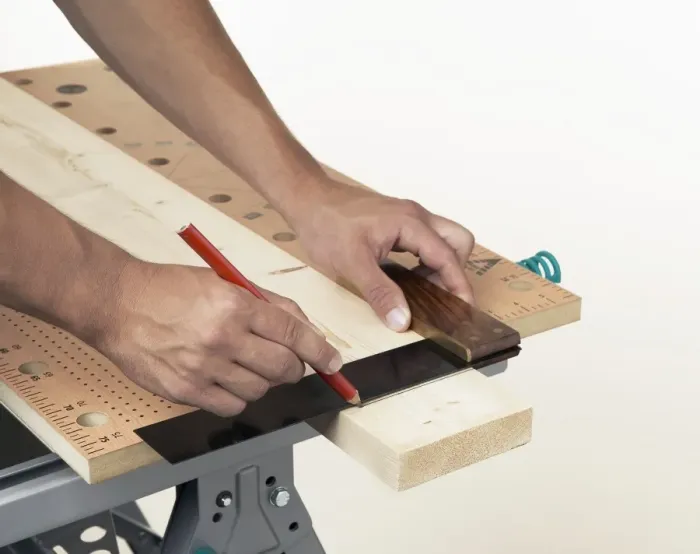 Framed Print : Person marking line on wood against square Framed Print : Person marking line on wood against square