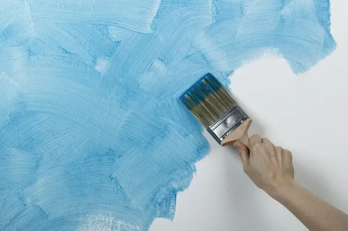 Framed Print : Person painting glaze onto wall with brush Framed Print : Person painting glaze onto wall with brush