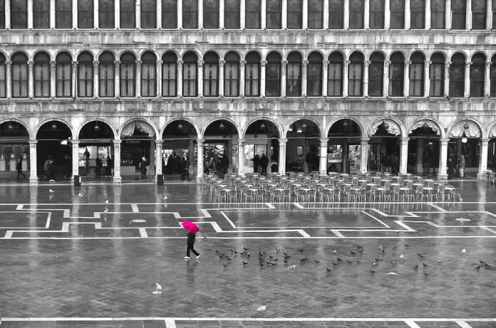 Framed Print : One person with a red umbrella crossing the St Marks Square by a rainy day in winter in Venice, Italy Framed Print : One person with a red umbrella crossing the St Marks Square by a rainy day in winter in Venice, Italy
