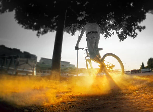 Dust. Person riding bicycle