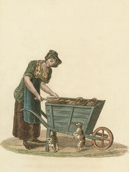 Pet Food. circa 1895: A woman sells pet food from a wheel barrow