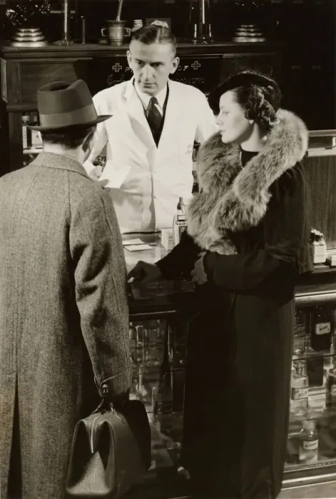 Framed Print : Pharmacist fills prescription for couple Framed Print : Pharmacist fills prescription for couple