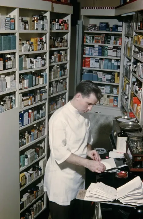 Framed Print : Pharmacy. NEW YORK - SEPTEMBER 1941: A Pharmacist prepares a prescription Framed Print : Pharmacy. NEW YORK - SEPTEMBER 1941: A Pharmacist prepares a prescription