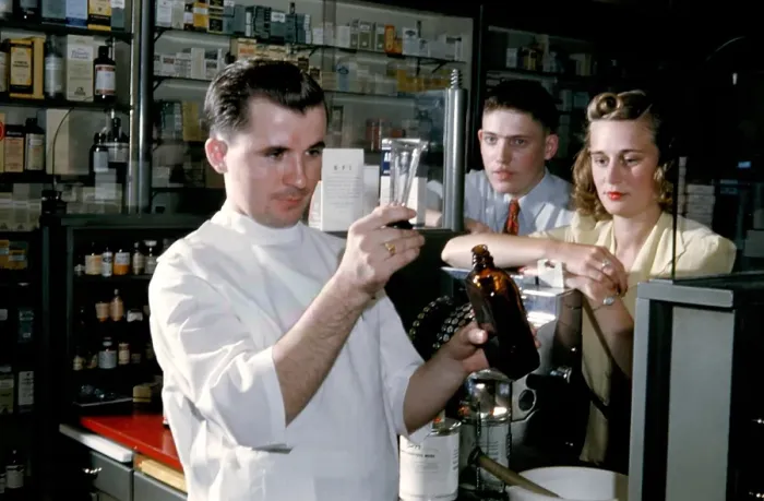 Framed Print : Pharmacy. NEW YORK - SEPTEMBER 1941: A Pharmacist prepares a prescription Framed Print : Pharmacy. NEW YORK - SEPTEMBER 1941: A Pharmacist prepares a prescription