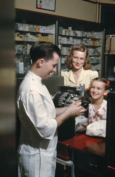 Framed Print : Pharmacy. NEW YORK - SEPTEMBER 1941: A Pharmacist serves customers in September Framed Print : Pharmacy. NEW YORK - SEPTEMBER 1941: A Pharmacist serves customers in September
