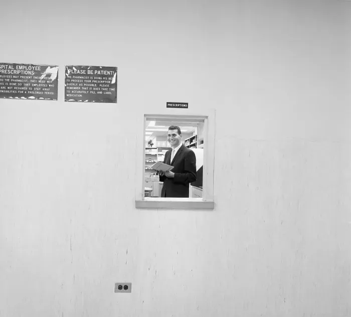 Framed Print : Pharmacy Director Standing in Window Framed Print : Pharmacy Director Standing in Window